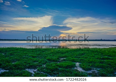 There is a beautiful cloud reflecting on the water At Bueng Khong Long, Bueng Kan Province of Thailand. Royalty-Free Stock Photo #1722482026
