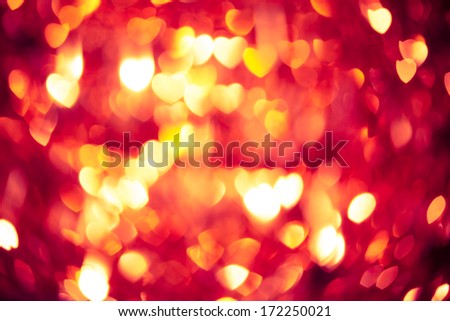 abstract red background with glowing hearts