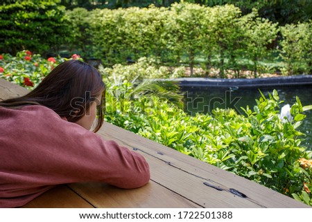 Woman looking at garden