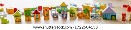 Banner Colorful wooden building blocks on floor children room. Selective focus