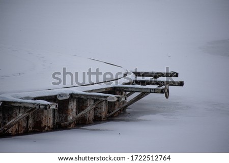 A lonely boat dock in the middle of winter.