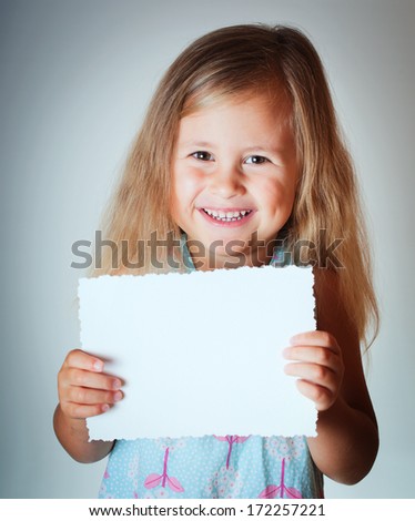 Happy child with paper blank