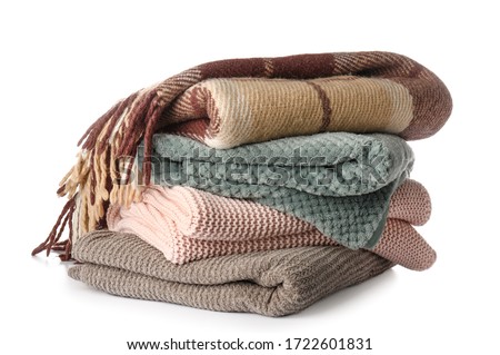 Soft blankets on white background Royalty-Free Stock Photo #1722601831