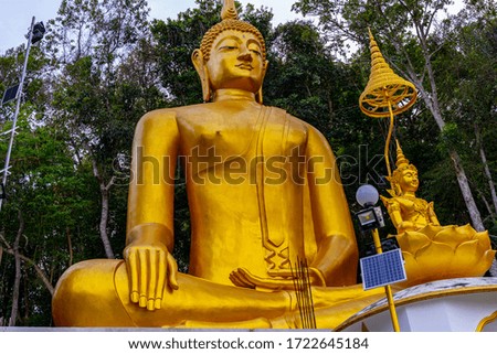 Buddha on the top Mountain of Wat Tham Seua tiger Cave in Krabi,Thailand .