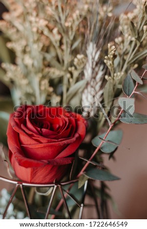 red rose flower bouquet in a jar 