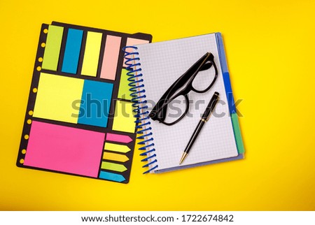 Stationary concept. Pen, glasses sticky note. Office supplies.