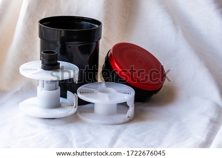 Accessories for developing film format 120 and 135. Close-up. Selective focus