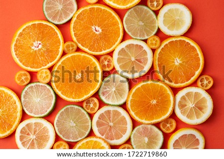 Selection of citrus slices on paper background 2