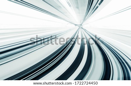 Motion blur of train moving inside tunnel with daylight in tokyo, Japan, gray color