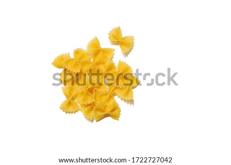 Raw organic farfalle pasta. Pieces of traditional Italian farfalle pasta isolated on a white bachground. Italian Cuisine. Bow tie noodles. Uncooked dried farfalle. Butterfly. Top view. Copy space. Royalty-Free Stock Photo #1722727042