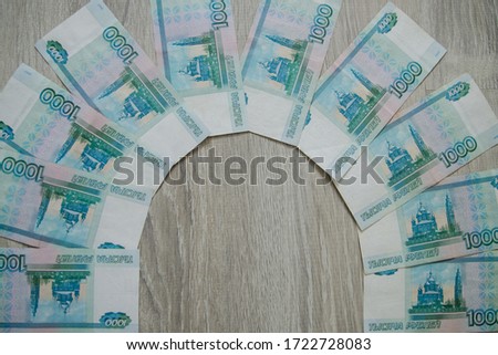 Business, finance, saving, banking and people concept - close up of woman hands with bundle of money Russian Banknotes thousand rubles with free space for text