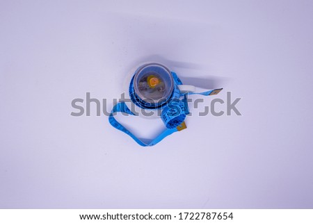 Save energy. Measuring tape on candle fake flame.  Save energy concept image