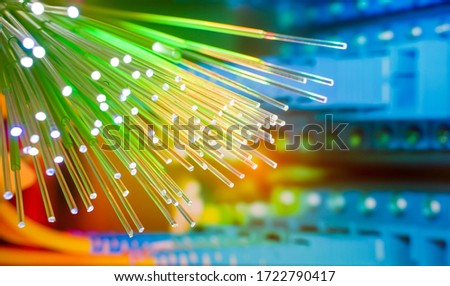 Fiber optics network cable on technology background Royalty-Free Stock Photo #1722790417