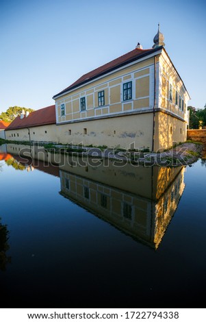 Castle Kottingbrunn during summer with the reflecting lake