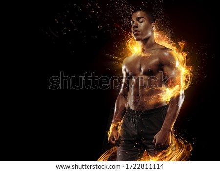 Sport. Dramatic portrait of professional athlete. Winner in a competition. Fire and energy. Royalty-Free Stock Photo #1722811114