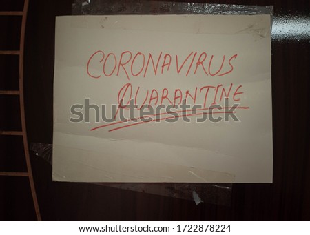 Self Quarantine door sign for front of house, because of Coronavirus. corona virus quarantine room with banner in front of the door.Selective focus
