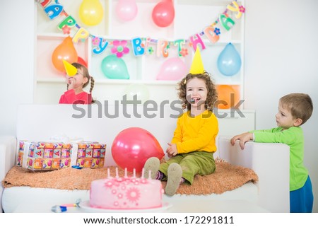 A group of children at a birthday party Blurred motion and shallow doff.