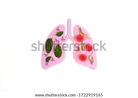 Coronavirus concept. Paper lungs with red balls. Minimal paper art. World Tuberculosis Day or World Lung Day concept. Pink Hole Lungs as symbol of healthy lungs.