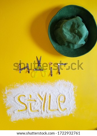 set of items on a yellow background for hairdressing art. pink hair for afro braiding. hairdressing concept
