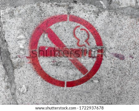 no Smoking sign on the gray wall