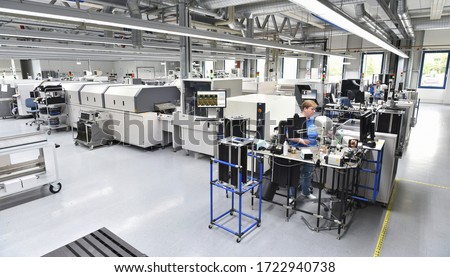 modern industrial factory for the production of electronic components - machinery, interior and equipment of the production hall  Royalty-Free Stock Photo #1722940738