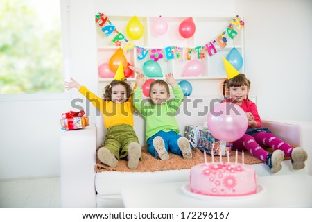 A group of children at a birthday party. A little blurred motion and shallow doff.