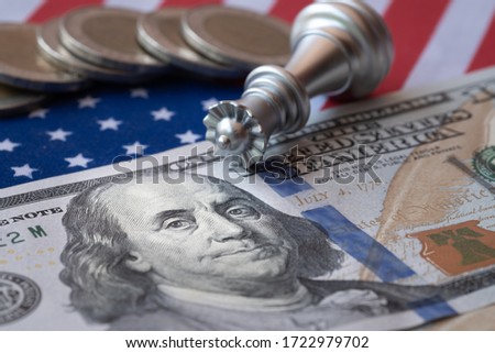 Queen fall down on US flag and dollar. USA economic recession because of virus outbreak. Royalty-Free Stock Photo #1722979702