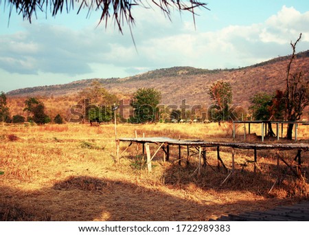 The picture shows the countryside with mountains around.