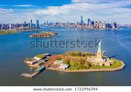 Aerial View of Statue of Liberty, Ellis Island and Lower Manhattan Skyline from New York Harbor near Liberty State Park in New Jersey