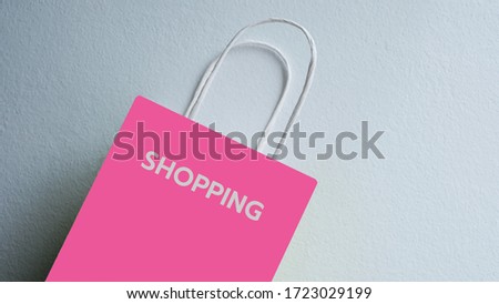 Paper shopping bags pink on white background.