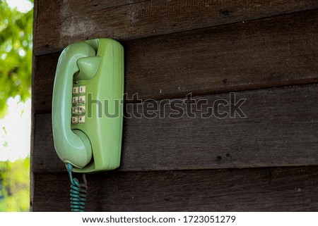 Telephone vintage on the wood wall.