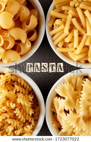 Template for pasta recipe with various raw pasta in white bowls. Overhead view with text. 