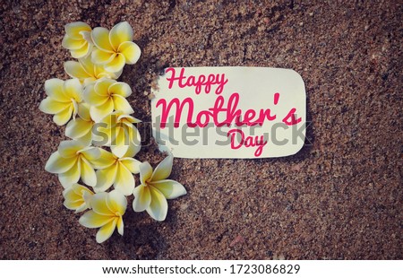 Happy Mother's Day Wish Written on White Paper Note with Plumeria Flowers on Sand, Happy Mother's Day Conceptual Photo, Perfect for Wallpaper 