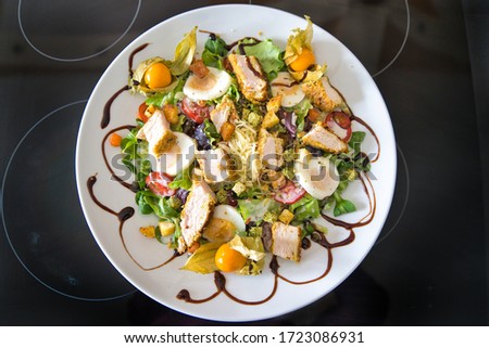 Mixed organic salad plate with chicken strips, tomatoes, eggs, bell pepper, lamb's lettuce, balsamic vinegar and croutons, product image