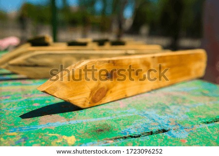 Wooden pointers on a metal table