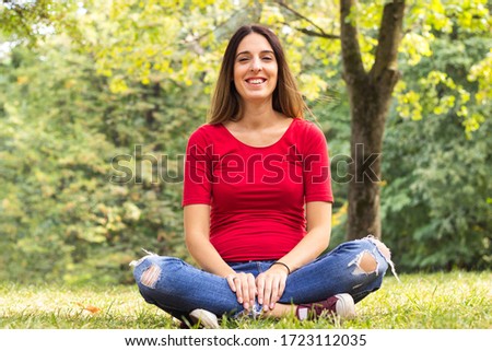 Smiling pregnant woman enjoying the fresh air