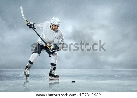 Ice hockey player on the ice Royalty-Free Stock Photo #172313669