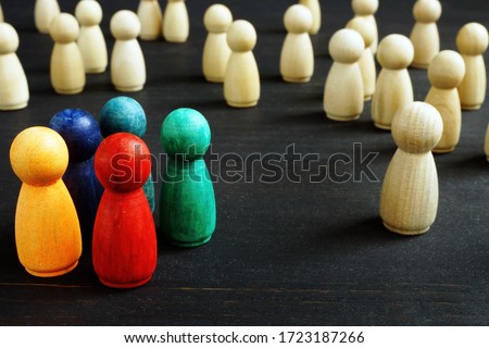 Inequality and racism concept different wooden figures. Royalty-Free Stock Photo #1723187266