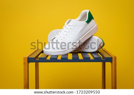 Athletic shoes. White sports shoes.