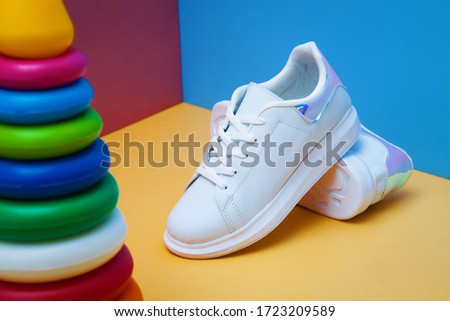 Athletic shoes. White sports shoes.