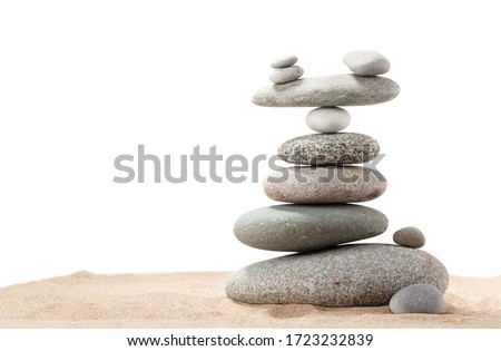Pyramid of sea pebbles. Isolated on white background. Life balance and harmony concept