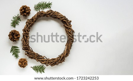 Base for Christmas wreath or nest for Easter on white background, cones and branches of spruce. Handwork with creativity, needlework with children. DIY, decoration to holidays. Flatly with