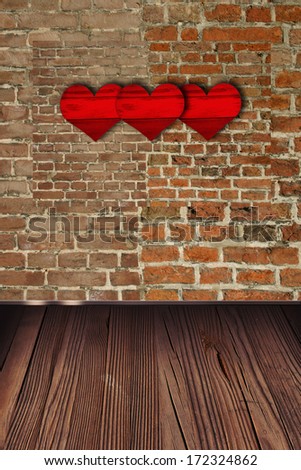 Heart hanging on a brick wall  with vintage floor