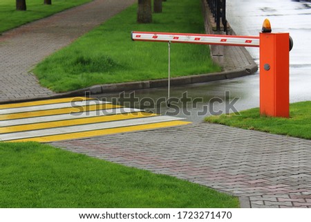 barrier at the entrance to a private parking in the city park