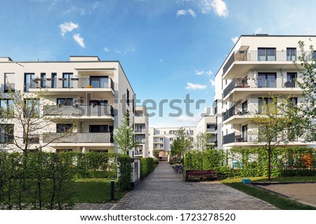 Cityscape of a residential area with modern apartment buildings, new green urban landscape in the city Royalty-Free Stock Photo #1723278520