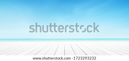 Sea beach background with white wood panel floor foreground. Landscape cloud blue sky summer. Royalty-Free Stock Photo #1723293232