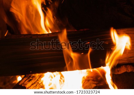 Logs burning in a roaring fire