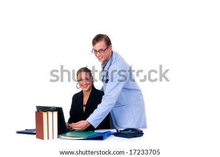 Medical team,  male cardiologist and female assistant in the office.  Studio, white background.