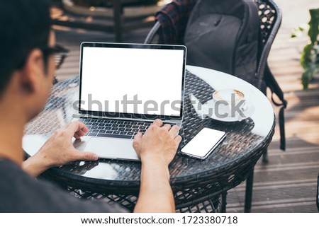 computer,cell phone mockup image blank screen with white background for advertising,hand woman work using laptop texting mobile contact business search information on desk in cafe.marketing,design