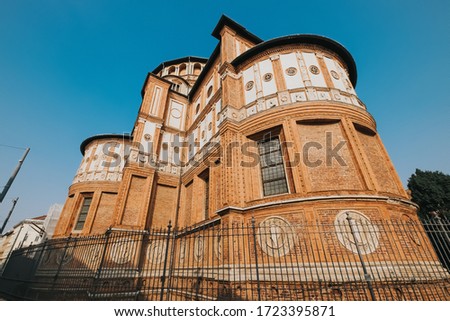 Back side of Church of Holy Mary of Grace (Chiesa di Santa Maria delle Grazie, 1497) A famous church for tourist in Milan, Italy, picture with grain film effect